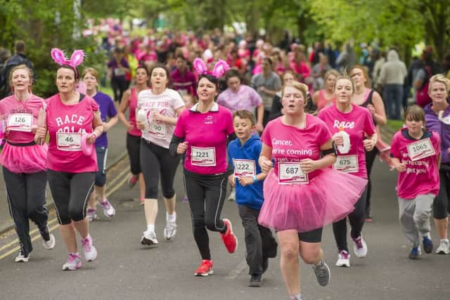 Runners along the route during  the 2015 Wakefield Race For Life.

Picture by Allan McKenzie