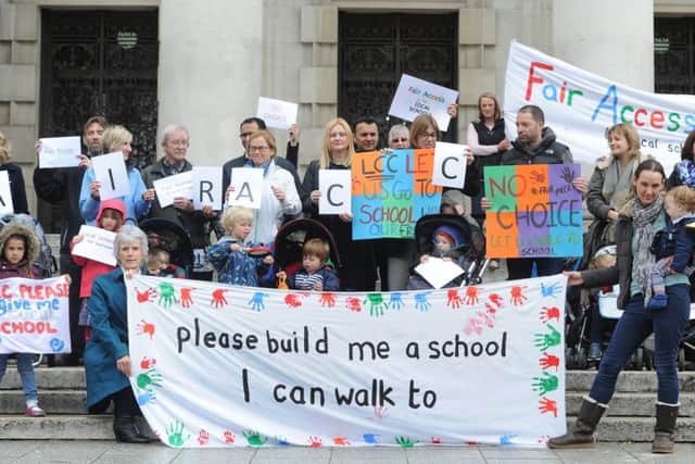 Parents protest outside Leeds' Civic Hall over school places "blackhole." Photo: James Hardisty