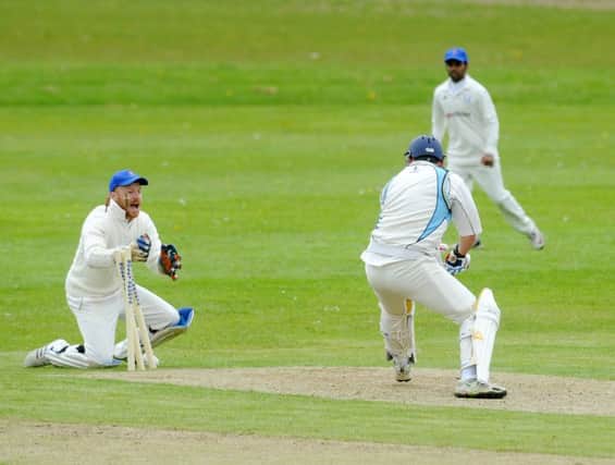 HOW IS THAT: 
Mirfield wicketkeeper Tom Wilkes stumps Oulton's Will Harrison in their Central Yorkshrie League clash at the weekend Picture: Steve Riding.