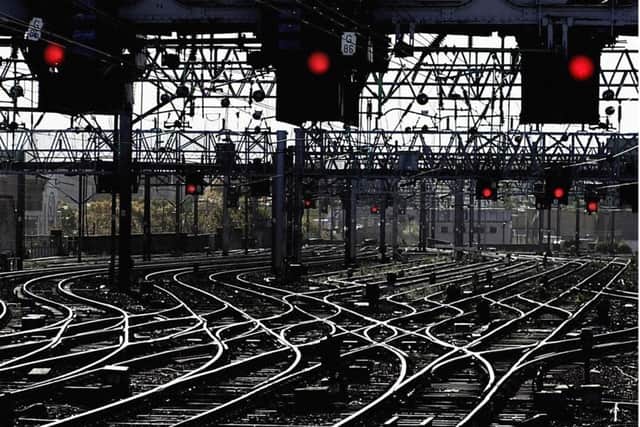 Signal lights all turned to red and lines standing empty as train companies have started cancelling services over the Bank Holiday