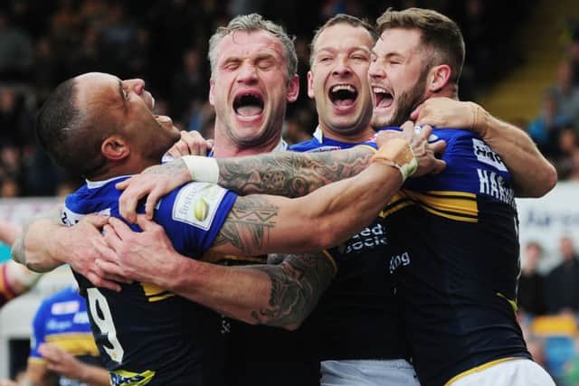 Paul Aiton, Jamie Peacock, Danny McGuire and Zak Hardaker celebrate a try in their sixth round win over Huddersfield Giants. Picture: Steve Riding.