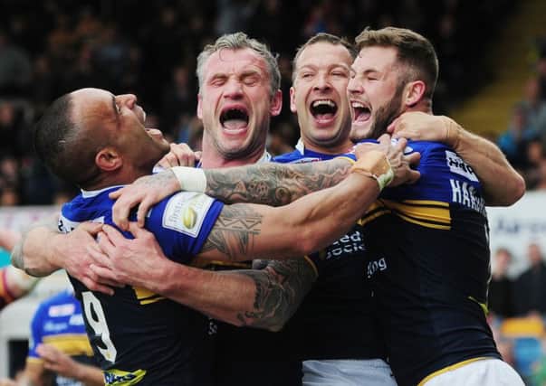 Paul Aiton, Jamie Peacock, Danny McGuire and Zak Hardaker celebrate a try in their sixth round win over Huddersfield Giants. Picture: Steve Riding.