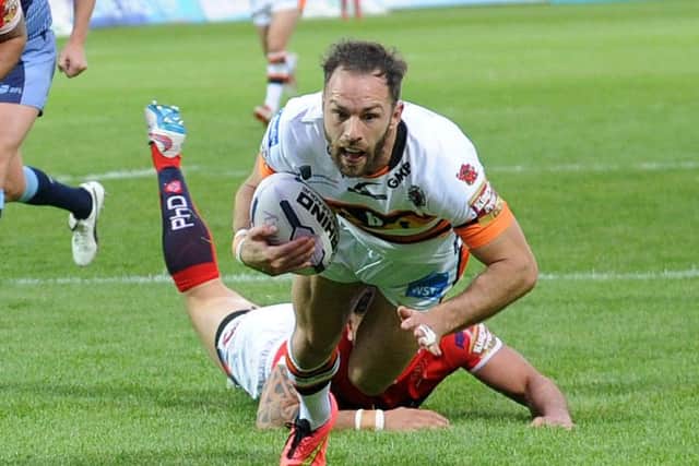 Luke Gale scores his try for Castleford at Hull KR on Friday night and, below, celebrates.