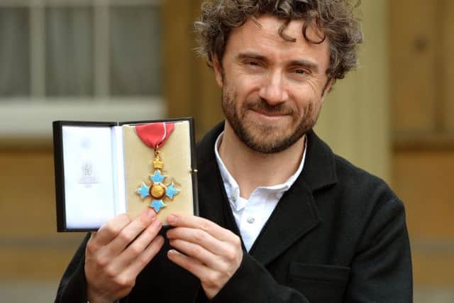 Designer Thomas Heatherwick holds his CBE (Commander of the British Empire), after it was presented to him by the Prince of Wales, during a Investiture ceremony at Buckingham Palace in central London. PRESS ASSOCIATION Photo. Picture date: Friday February 7, 2014. See PA story ROYAL Investitures. Photo credit should read: John Stillwell/PA Wire
