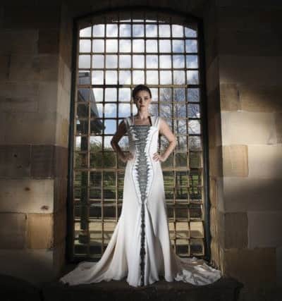 Clare wears 3D snake-front evening dress made from sateen silk and georgette. Made to order, price on application