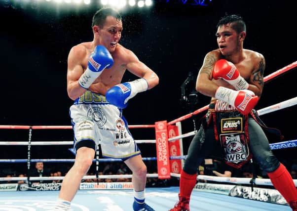 Josh Warrington claimed the WBC International Featherweight title against durable Filipino Dennis Tubieron with a wide points win in front of a huge hometown crowd at the First Direct Arena in Leeds. 
11th April 2015.
Picture : Jonathan Gawthorpe