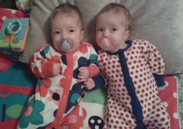 Identical twin baby sisters Neve & Belle Boitelle