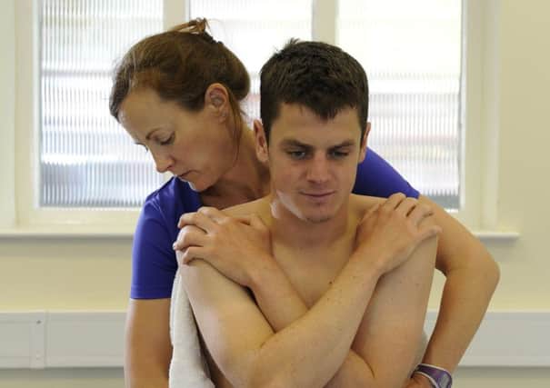 Jonny Brownlee with physio Alison Rose before the stress fracture injury (Picture: Bruce Rollinson)