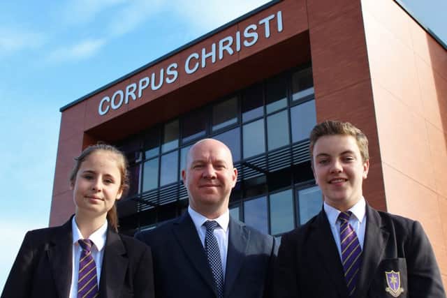 Pictured is Steve Mort (headteacher) with the head girl and head boy - Amelia Rathbone and Joseph Wilson.