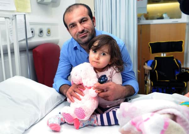 Abdul Mosa and daughter Arda, who survived crash in Kent. Pictrure: Ross Parry Agency