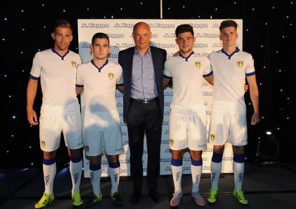 Uwe Rosler, centre, with from left Charlie Taylor, Lewis Cook, Alex Mowatt and Sam Byram