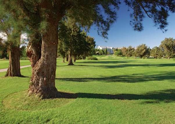 A view up the 18th fairway of the Sir Henry Cotton Championship course towards the Penina Hotel.