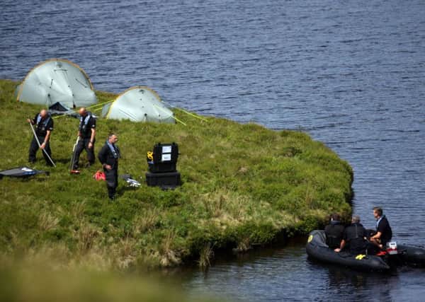 Police search in Snailsden Reservoir for a missing man last year. Pic: Ross Parry