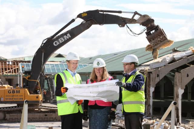 Adrian Taylor, of P+HS Architects of Stokesley, Heather Parry, deputy chief executive of the Yorkshire Agricultural Society and Nick Todd, regional business unit manager at Clugston, as work begins on the £10m new exhibition hall at the Great Yorkshire Showground, Harrogate.