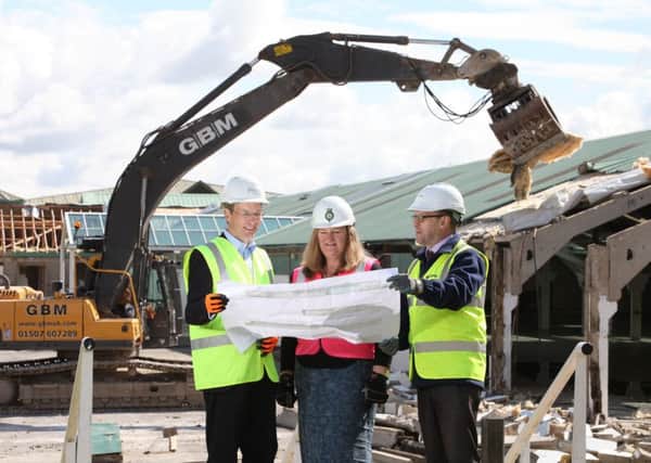 Adrian Taylor, of P+HS Architects of Stokesley, Heather Parry, deputy chief executive of the Yorkshire Agricultural Society and Nick Todd, regional business unit manager at Clugston, as work begins on the £10m new exhibition hall at the Great Yorkshire Showground, Harrogate.