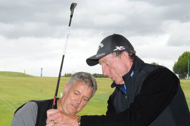David Leadbetter, one of the worlds leading golf instructors, demonstrates to Chris Stratford the backswing element of the A Swing during his recent visit to the Leadbetter Golf Academy at the Leeds Golf Centre at Wike Ridg (Picture: Steve Riding).
