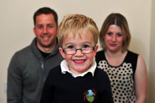 Sam Brown pictured with his parents Simon and Katy.
