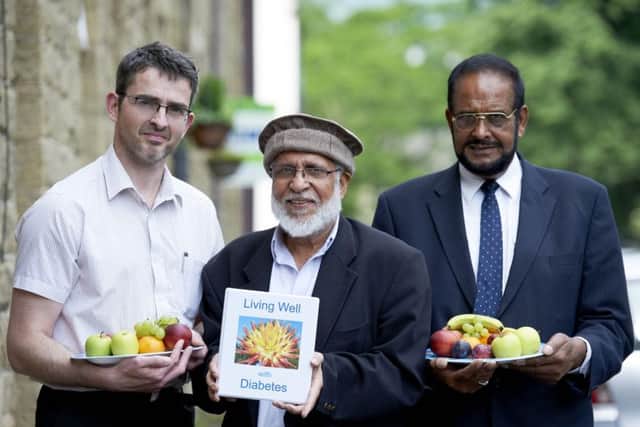 Greg Fell helps to launch a diabetes self-help pack in Keighley with Mohammed Hanif and Abdul Gafoor.