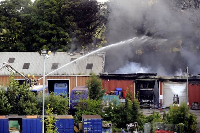 Firefighters tackle the blaze near Geldards Coaches in Whitehall Road, Leeds.  Picture: Bruce Rollinson