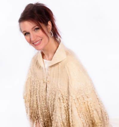 Wensleydale locks felted onto Merino and Silk Chiffon with hand spun slubbed yarn and mulberry silk fibres on the yoke.