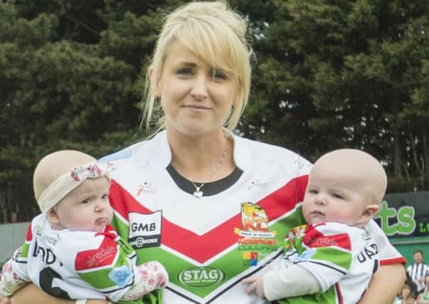 Lizzie Jones, Danny's widow, with their twins following his death.