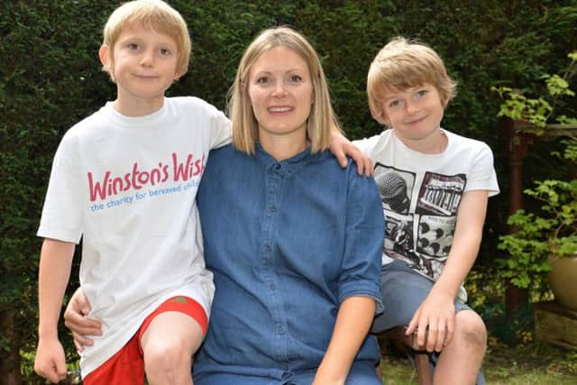 Alfie Jones, age nine, from Chapel Allerton with his mum Sallie Smith and his brother Leon. Alfie has run 27.2 miles and raised more than £2,500 for the children's bereavement charity Winston's Wish to thank them for the support they gave him after his father was killed in an accident. Picture: Anna Gowthorpe