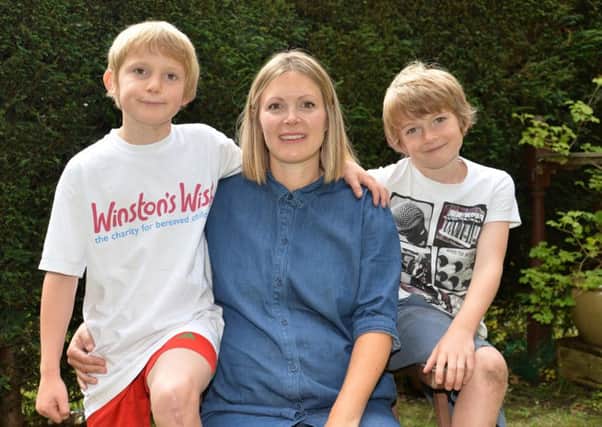 Alfie Jones, age nine, from Chapel Allerton with his mum Sallie Smith and his brother Leon. Alfie has run 27.2 miles and raised more than £2,500 for the children's bereavement charity Winston's Wish to thank them for the support they gave him after his father was killed in an accident. Picture: Anna Gowthorpe