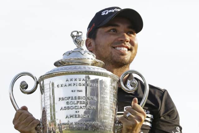 Australian Jason Day smiles as he holds up the Wanamaker Trophy after winning the US PGA Championship