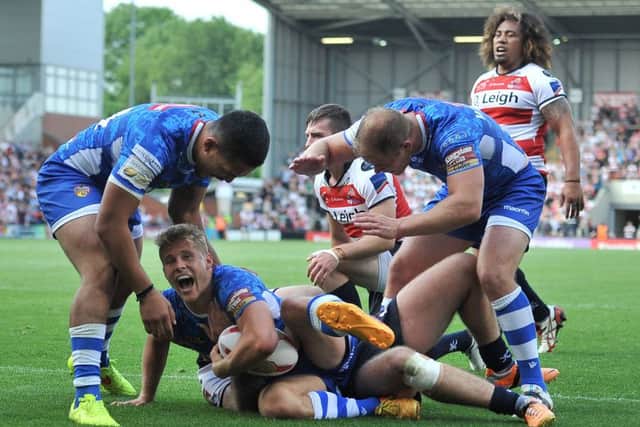 Wakefield Trinity Wildcats's Jacob Miller scores his side's third try against Leigh.