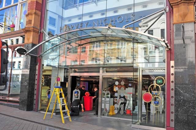 Workers repair the damage after a ramraid at Harvey Nichols on Briggate in the centre of Leeds. Picture Tony Johnson