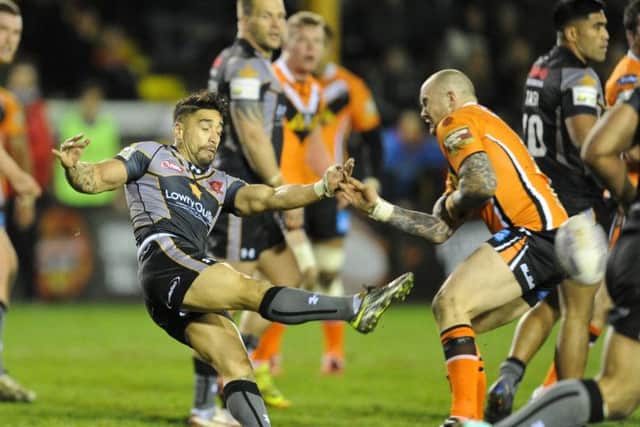 Rangi Chase, left, in action against former club Castleford.