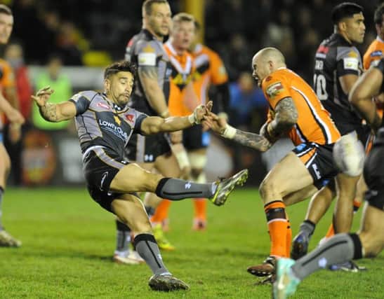 Rangi Chase, left, in action against former club Castleford.