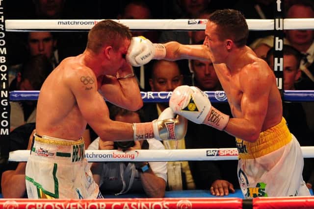 WINNER: Josh Warrington, right, takes on Joel Brunker. Picture: Tony Johnson