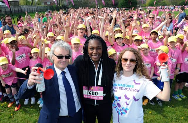 2,000 school children take part in the Run For Fun, to raise money in memory of Ann Maguire at St Theresa's Catholic Primary School. Pictured starting the race are Ann's widow Don, daughter Kerry and Olympian Perry Shakes-Drayton. Picture Jonathan Gawthorpe.