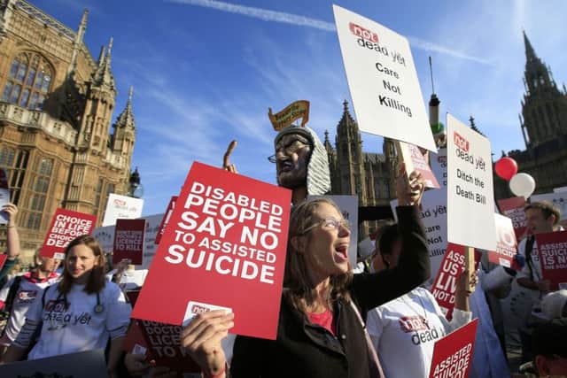 Protesters outside the Houses of Parliament as MPs debate and vote on the Assisted Dying Bill.