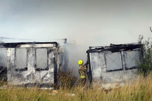 Firefighters put out the blaze at portable buildings near Robin Hood, Leeds. Picture by Simon Hulme