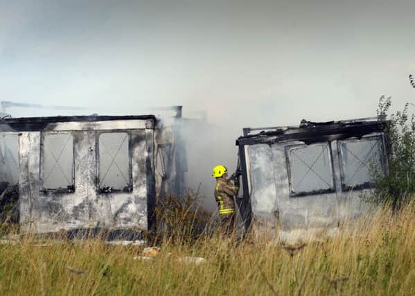 Firefighters put out the blaze at portable buildings near Robin Hood, Leeds. Picture by Simon Hulme