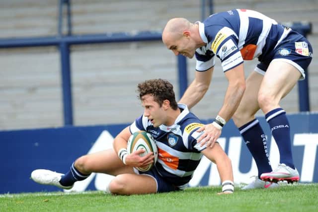 David Doherty congratulates Max Green on his debut try for Leeds Carnegie (Picture: Steve Riding).