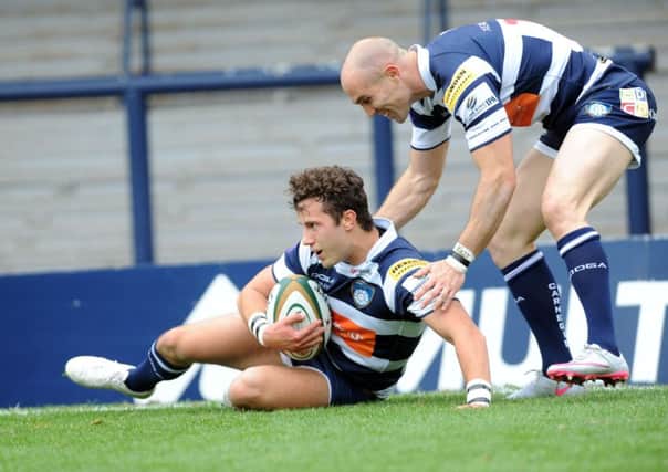 David Doherty congratulates Max Green on his debut try for Leeds Carnegie (Picture: Steve Riding).