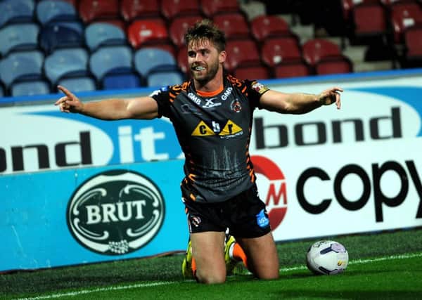 Ashley Gibson celebrates a try for Castleford Tigers.