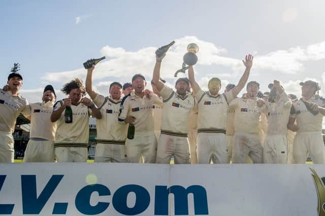 Yorkshire's captain Andrew Gale holds the LV County Championship trophy aloft as his team celebrates victory. Picture: SWPIX.COM