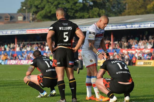 Bradford Bulls players Jay Pitts, Danny Williams and Dale Ferguson are dejected after losing the Million Pound Game.