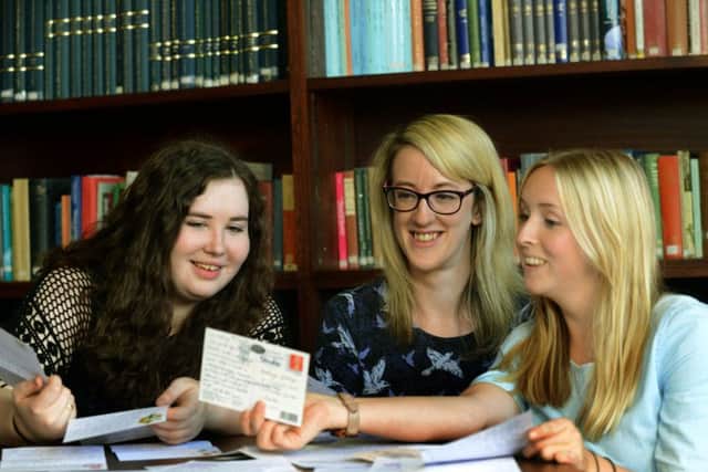 Bethany Gethings, Georgina Binnie and Lorna Donaghy  with some of the letters they have received affter setting up a penpal scheme  to help loneliness in older people. Picture: Gary Longbottom