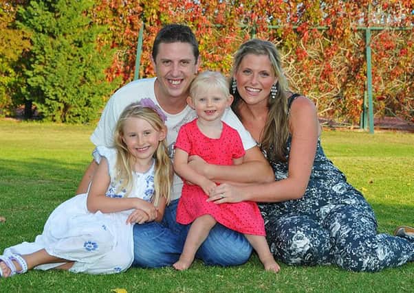 Pc David Phillips with wife Jen and daughters Abigail, 7, and Sophie, 3