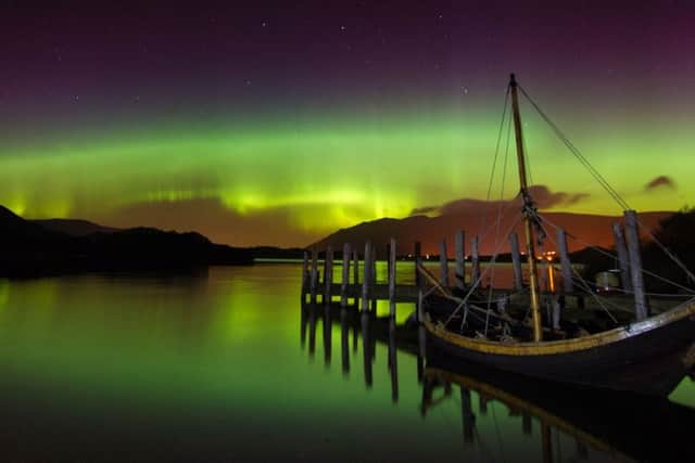 The Northern Lights, or Aurora Borealis, shine over Derwentwater, near Keswick in the Lake District.  PRESS ASSOCIATION Photo. Picture date: Thursday October 8, 2015. The spectacular display was seen further south than usual after a recent geomagnetic storm.