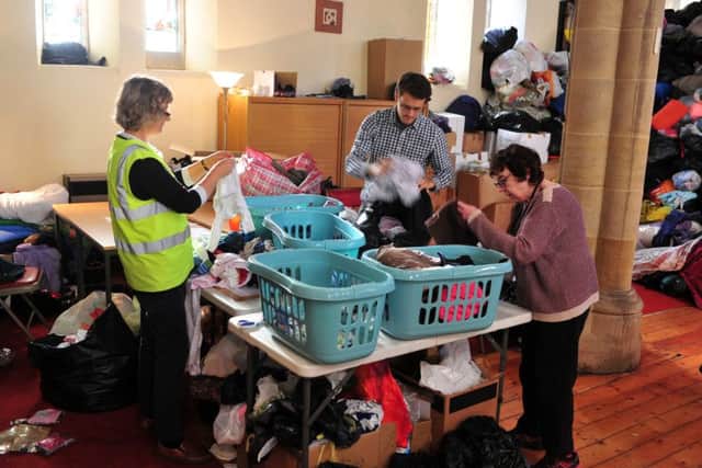Volunteers at St Luke's Church sort through some of the donations.
Picture: Tony Johnson