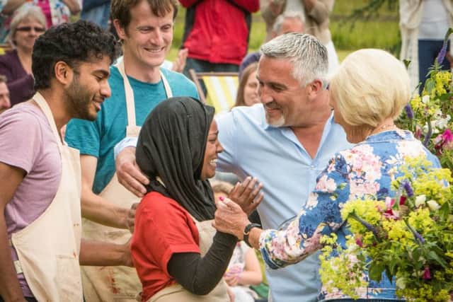 Nadiya Jamir Hussain celebrates with judges Paul Hollywood and Mary Berry. Love Productions/PA Wire