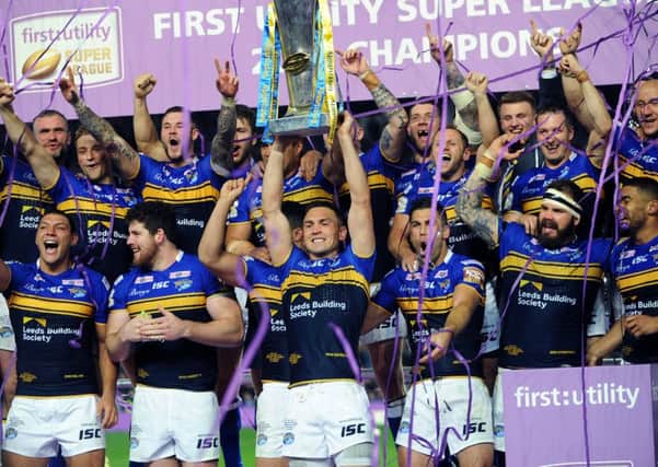 Leeds 
Rhinos Kevin Sinfield lifts the trophy.
