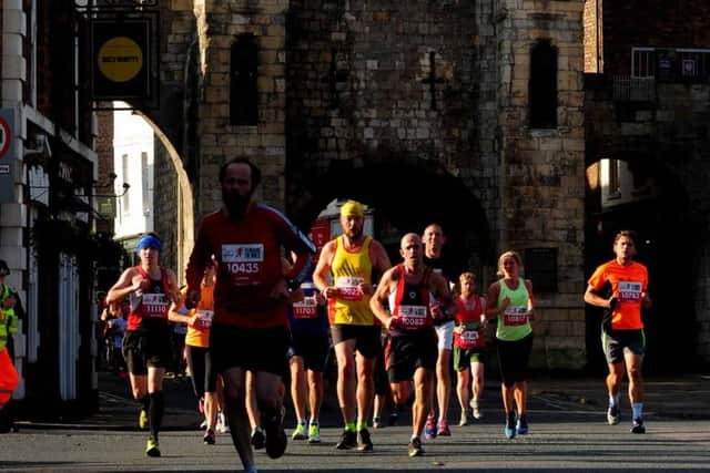Competitors take part in the Plusnet Yorkshire Marathon, racing through the heart of York. Picture by Anthony Chappel-Ross.