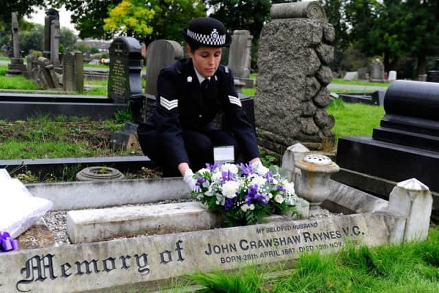 Sergeant Lucy Leadbeater, of West Yorkshire Police, lays a wreath at the grave of John Crawshaw Raynes in Harehills Cemetery. Picture Bruce Rollinson.
